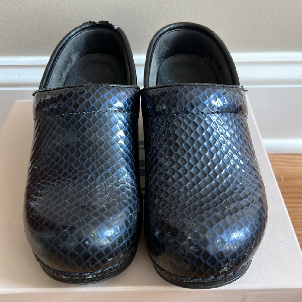 Women’s  Dansko clogs. Navy blue. Pre owned. Some signs of wear . See photos